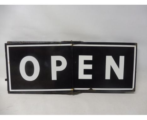 An enamel sign with hinge to flip between Open and Closed, 16 1/2 x 6 1/2". 