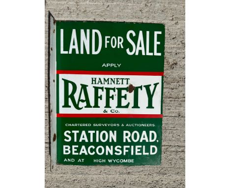 A double sided 'Land For Sale' enamel sign with hanging flange, for agents Hamnett Raffety &amp; Co. Station Road Beaconsfiel