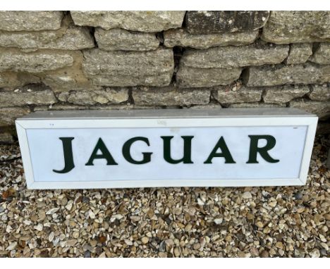 A contemporary Jaguar light-up sign with green  lettering on white panel, 39 1/4 x 10 1/4", depth 7".