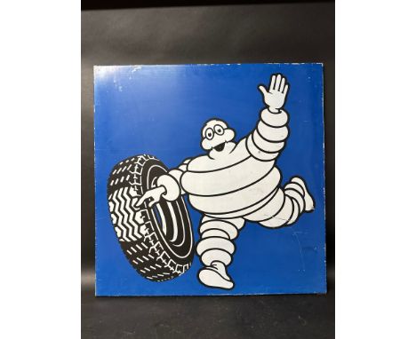 A large Michelin single sided enamel sign depicting Mr Bibendum rolling a tyre ,made in France with wall hanging bracket, 31 