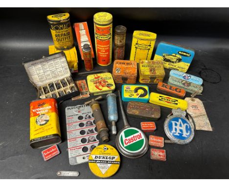 A selection of tins and advertising packaging including Dunlop, John Bull, Champion and Romac etc.
