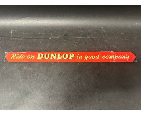 A Ride on Dunlop in Good Company printed tin advertising shelf strip, 18" across.