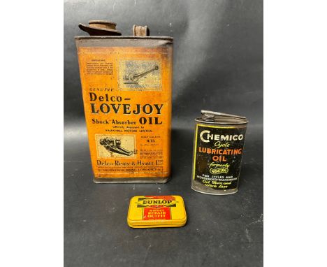 A Delco Lovejoy Shock Absorber oil can together with Chemico oval lubricating oil and Dunlop Midget repair outfit tins.