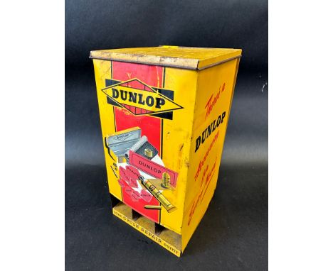 A Dunlop 'Silent Salesman' wall mounted tin cabinet dispensing cycle repair outfit tins.