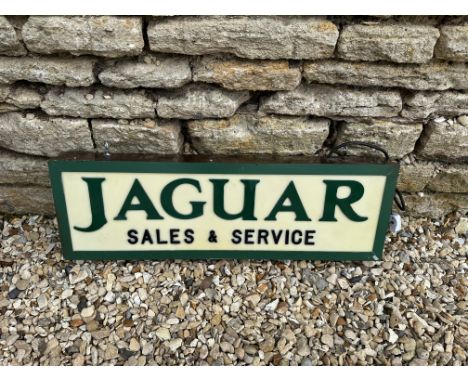 A contemporary Jaguar light-up sign with green  lettering on white panel, 30 1/4 x 9 3/4", depth 3.5".