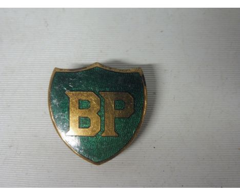 A BP shield shaped badge by J.R. Gaunt, London.