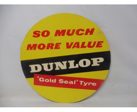A Dunlop Tyres circular cardboard tyre insert sign: So much more value Dunlop 'Gold Seal' Tyre, 17" diameter.