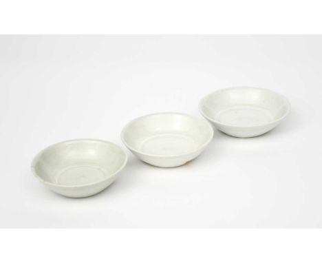 Richard Batterham (1936-2021)a set of three porcelain avocado dishes, covered in a pale blue oak ash glazeunsigned, applied e