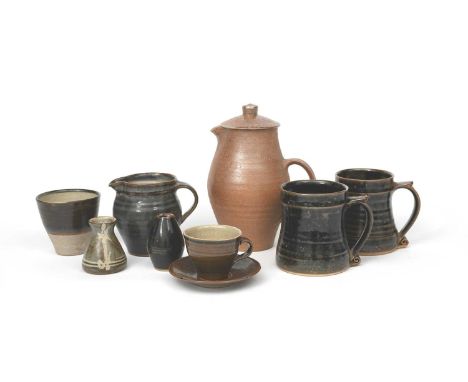 Leach Potterya salt-glaze stoneware coffee pot and cover, two tankards glazed in tenmoku, and a collection of Leach Pottery a