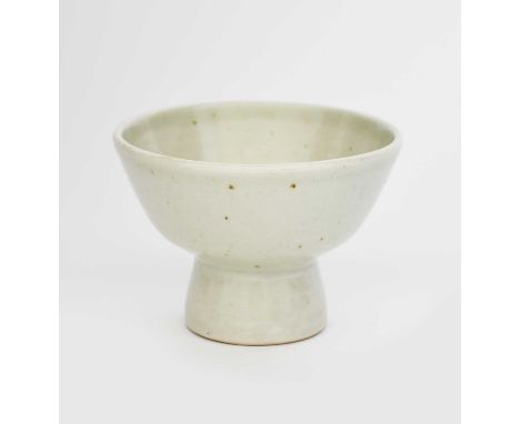 ‡ Bernard Leach CBE (1887-1979)a footed porcelain bowl, covered in a pale celadon glaze,impressed seal marks12cm. diam.9cm. h