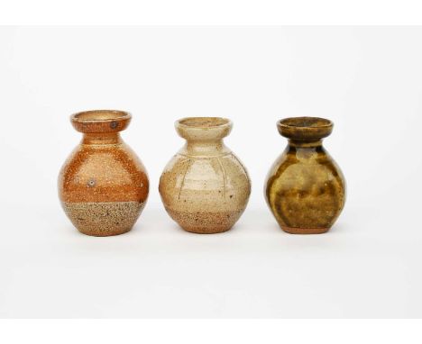 Richard Batterham (1936-2021)a salt-glaze stoneware flower bottle, with cut size, and two other beaten flower bottles by Rich