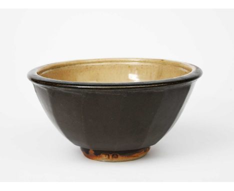 ‡ Jim Malone (born 1946)an Ainstable Pottery cut-sided stoneware bowl, the exterior glazed tenmoku, the interior ashimpressed