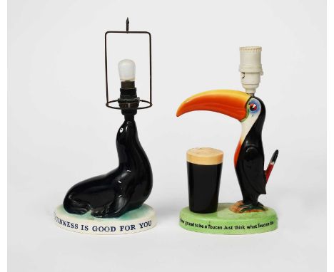 A Carlton Ware Guinness Toucan table lamp, modelled standing beside a pint of Guinness, glazed in colours, and a Carlton Ware