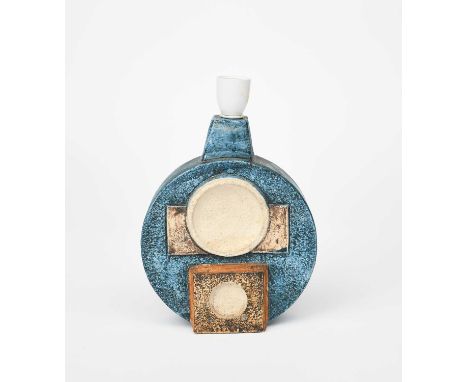 A Troika Pottery Wheel lamp base, round, cast in low relief with geometric panels in blue, tan and cream, painted factory mar