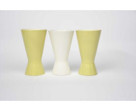 A pair of Poole Pottery Contemporary vases designed by Alfred Read, shape 714, covered in a lime yellow glaze, and another Po