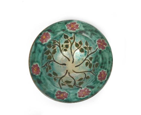 A small Della Robbia Pottery bowl by Tom Hall, painted with radiating flower stems in red and green on a turquoise ground, in