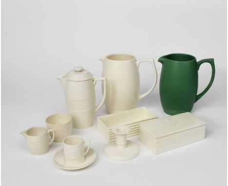 A Wedgwood Pottery coffee set designed by Keith Murray, covered in a matt white glaze, comprising coffee pot and cover, milk-