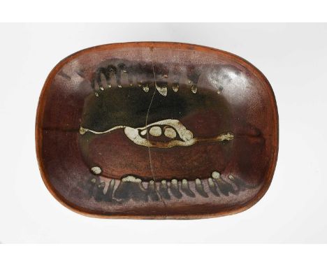 ‡ Michael Cardew CBE (1901-1993) attributedA Wenford Bridge stoneware oven dish, rounded rectangular section, with brushed de