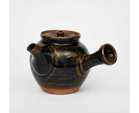 Atsuya Hamada (1932-1986)a stoneware teapot and cover, ovoid with side handle, covered in a tenmoku glaze,unsigned10cm. high 