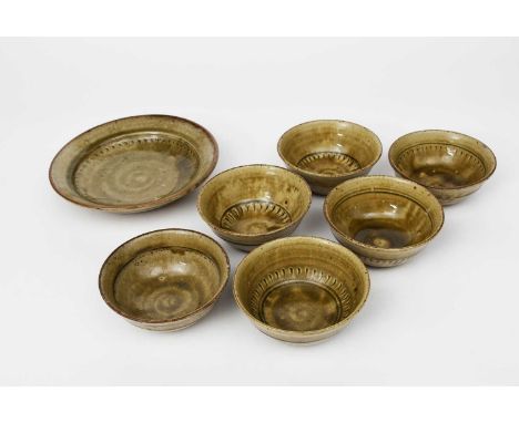 ‡ Richard Batterham (1936-2021)a stoneware plate with chatter bands, and six bowls, all covered with ash glaze,unsigned, chip