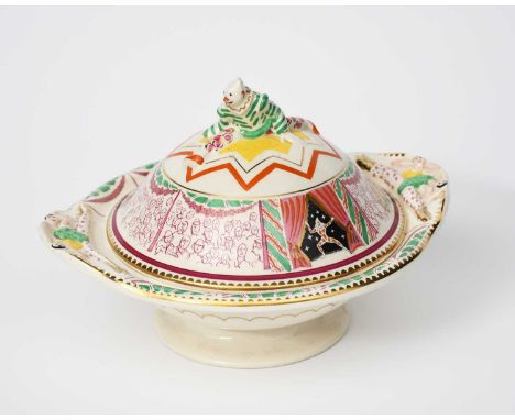 'Circus' a Clarice Cliff Bizarre tureen and cover designed by Dame Laura Knight, twin-handled form, the handles modelled in l