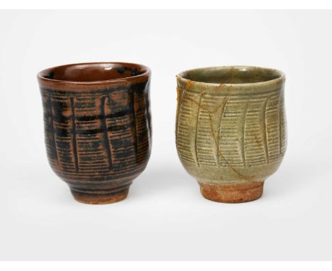 Atsuya Hamada (1932-1986)a stoneware unomi, footed form with incised decoration under a tenmoku glaze, and another similar gl