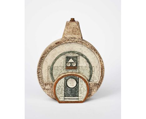 A Troika Pottery Wheel lamp base by Louise Jinks, cast in low relief with geometric panels, glazed blue, brown and buff paint