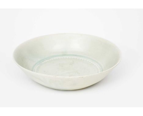 Richard Batterham (1936-2021)a porcelain bowl with chattering band, covered in a pale oak ash glazeunsigned, in half and re-s