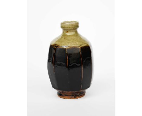 ‡ Jim Malone (born 1946)a cut-sided stoneware vase, shouldered form, the body glazed tenmoku over ash, impressed seal mark23c