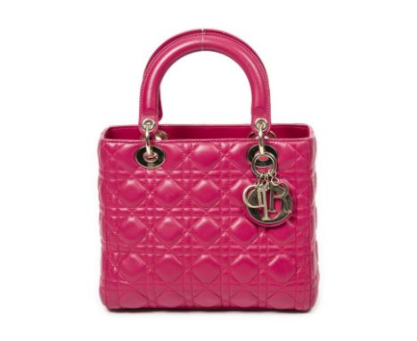 Christian DIOR, année 2014. Sac 'Lady Dior' cuir rose fuchsia à surpiqures cannage.Double poignée dont une agrémenté de brelo