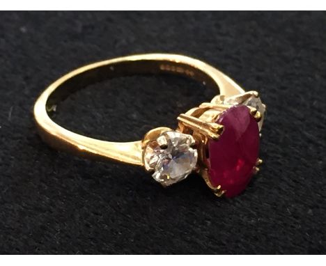 An 18ct ruby and diamond dress ring