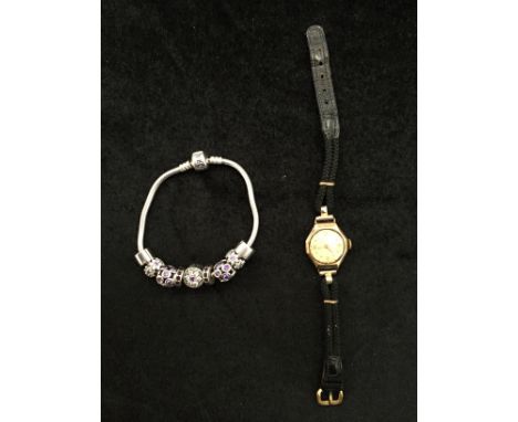 A 9-charm Pandora bracelet; together with a 9ct gold watch
