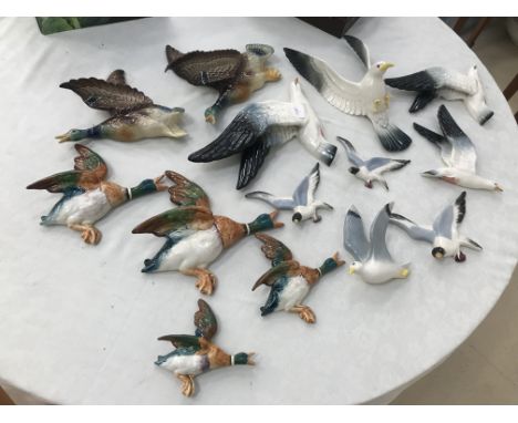 A large quantity of ceramic wall plaque flying ducks and seagulls to inc Beswick examples