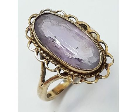 A hallmarked 9ct gold amethyst ring, size J gross wt. 3.4g.  Condition: a couple of minor areas of damage to the bezel mount,