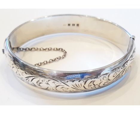 A hallmarked silver hinged bangle, diam. 6.5cm.  