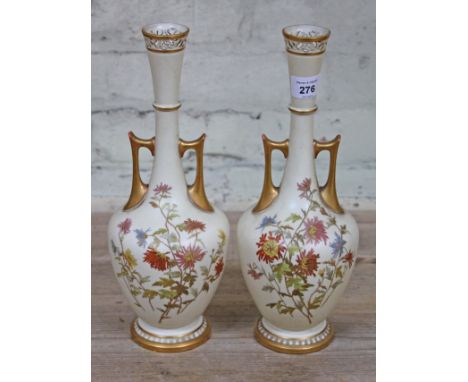 A pair of Royal Worcester blush ivory vases, height 32cm.Condition: No signs of damage or repairs, minor wear to gilding on t