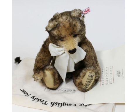 A Steiff English Musical Teddy Bear, limited edition no2148/4000, brown tipped mohair teddy bear complete with bow, ear tag, 