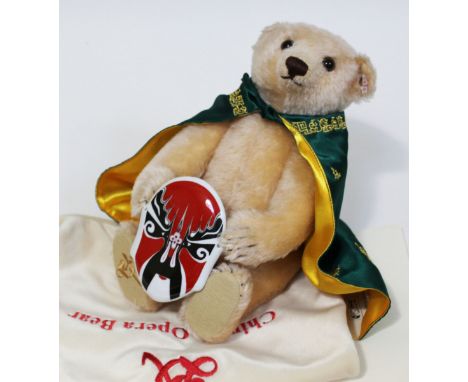 A Steiff Chinese Opera Bear, limited edition no377/1500, creme mohair teddy bear complete with pottery mask, gown, ear taga, 
