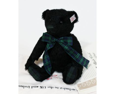 A Steiff "The Black Watch" musical bear, limited edition no1016/2000, black mohair teddy bear complete with tartan bow, ear t