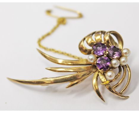 A 9ct gold brooch set with amethyst coloured stones and half cut pearls, length 4cm, gross wt. 5.6g  