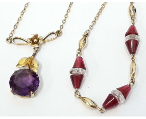 Two 9ct gold pendants, one set with an amethyst coloured stone, the other with ruby coloured stones, gross wt. 6.3g. 