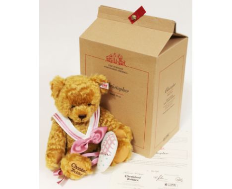 A Steiff Christopher bear, limited edition no725/2000, blonde mohair teddy bear complete with heart shaped cushion, bow tie, 