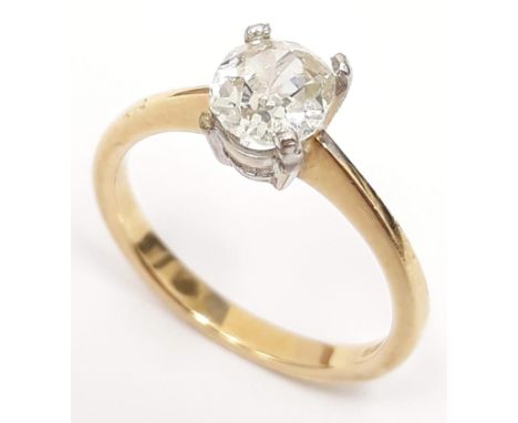 A single stone diamond ring, the oval cut stone approx. wt. 1 carats, band hallmarked 18ct gold, gross wt. 3g, size M. 