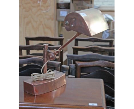 An early 20th century adjustable copper desk lamp.  