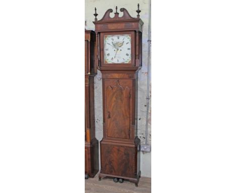 A George III mahogany eight day long case clock, swan pediment with turned finials, hood with turned columns, the body with a