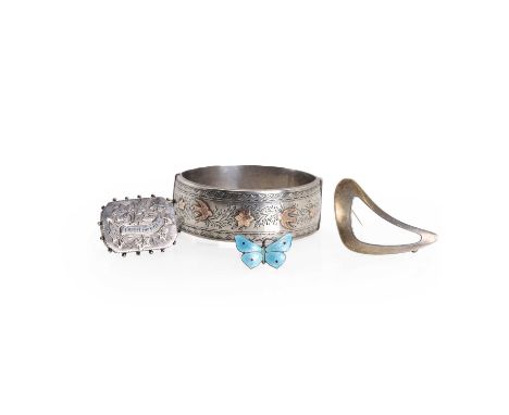 Three silver brooches and a silver bangle, Comprising:A silver blue enamel butterfly brooch, by John Aitken &amp; Sons,no.108