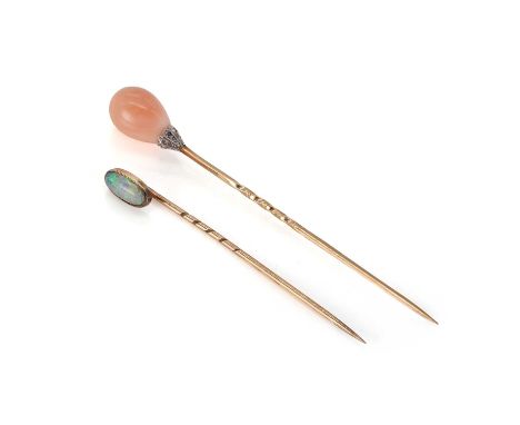 An antique coral and diamond stick pin and opal stick pin,  a peach coral pear shaped stone set into white metal with rose cu