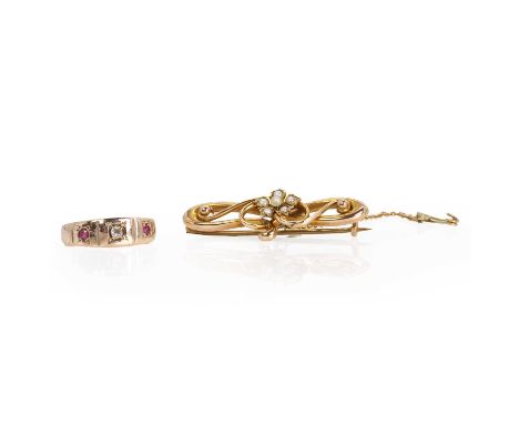 A gold three stone panel ring and a cased gold split pearl cluster bar brooch, comprising:a gold three stone ruby and diamond