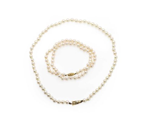 Two uniform single row cultured pearl necklaces, comprising a uniform single row cultured pearl necklace, untested, strung kn