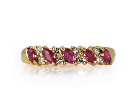 A 9ct gold ruby and diamond ring,  with an alternating double row of round cut diamonds and marquise cut rubies, to plain tap